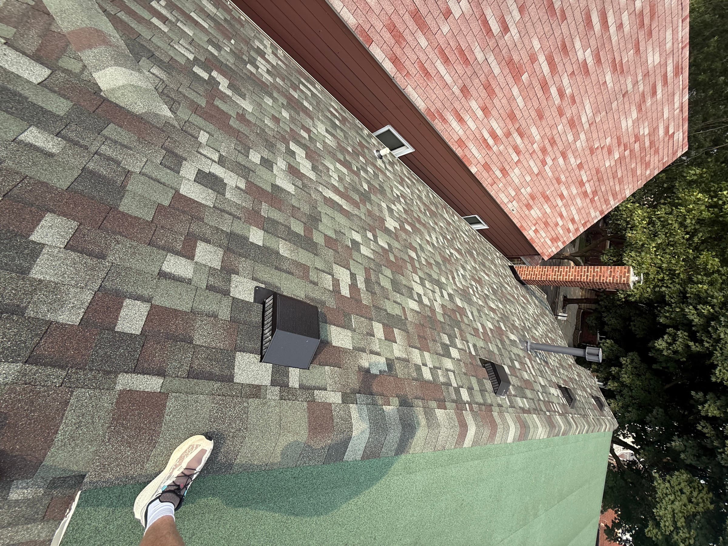 Ace roof replacement mid-install, new shingles going down over underlayment